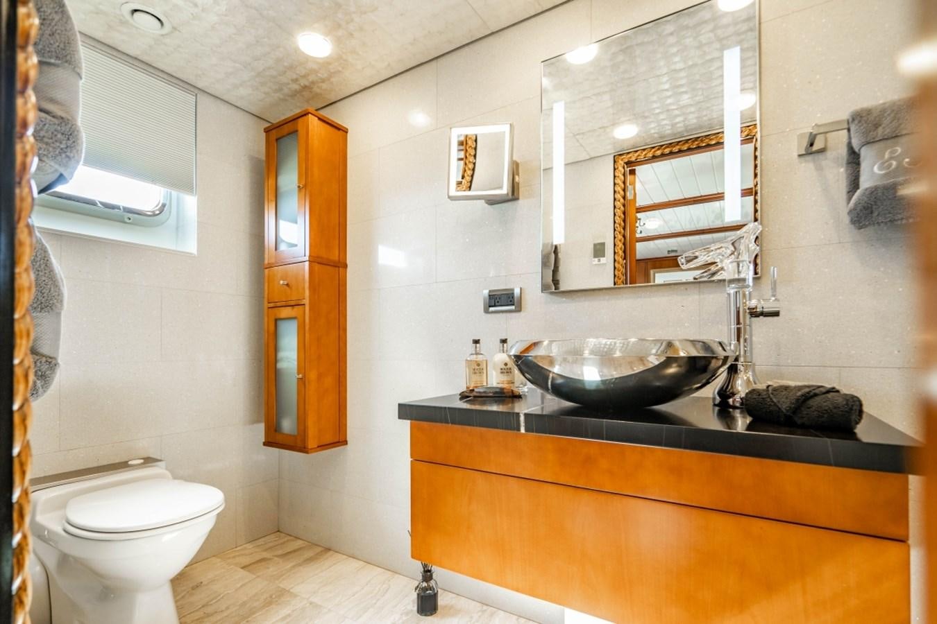 a bathroom with a sink and a toilet aboard DRAMA QUEEN Yacht for Sale