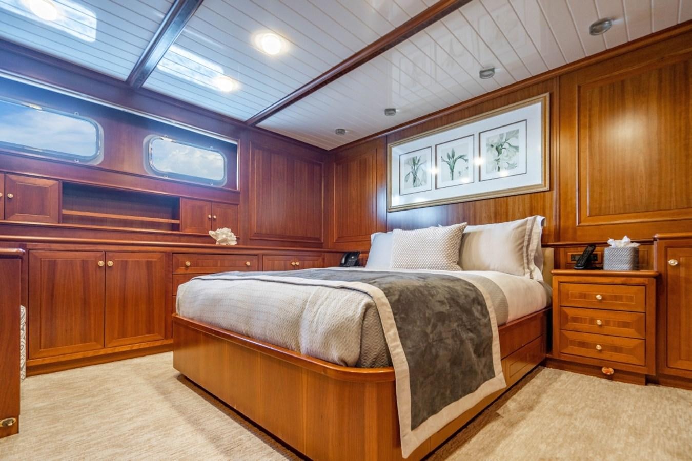 a bedroom with a bed aboard DRAMA QUEEN Yacht for Sale