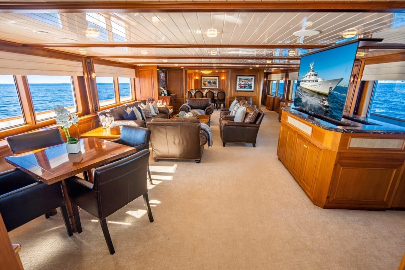 a room with a couch and a tv aboard DRAMA QUEEN Yacht for Sale