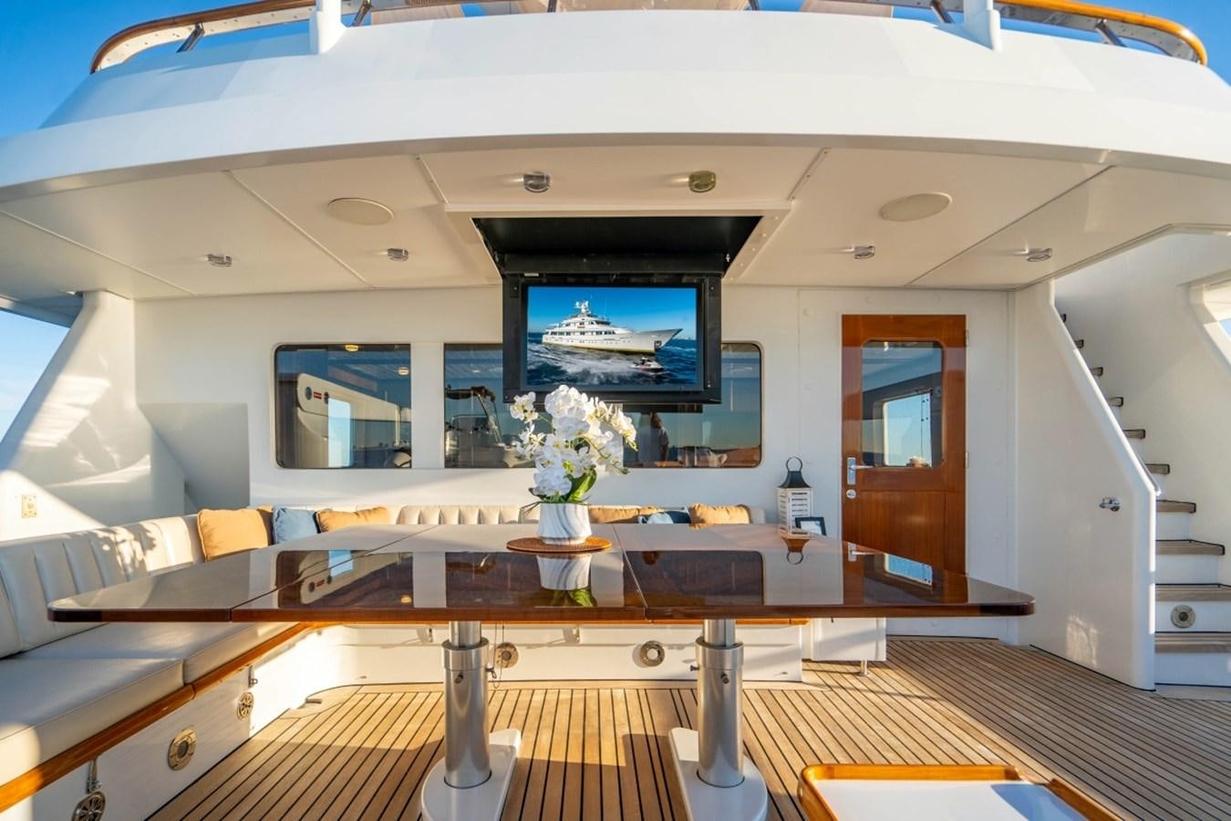 a room with a wood floor and a large window with a wood floor aboard DRAMA QUEEN Yacht for Sale
