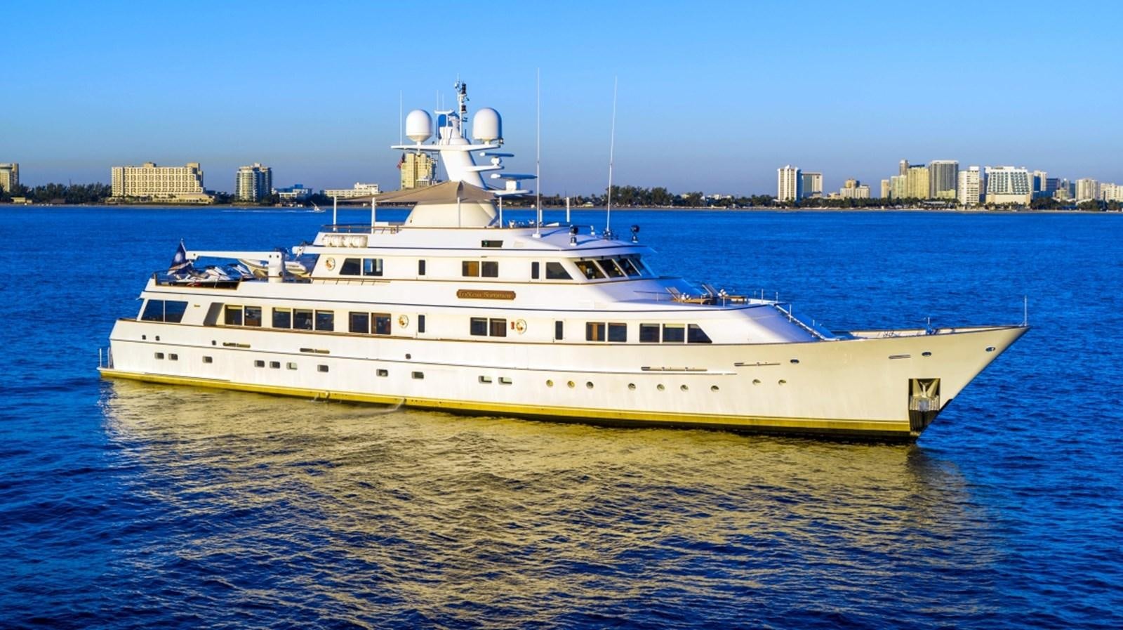 a large white boat in the water aboard DRAMA QUEEN Yacht for Sale