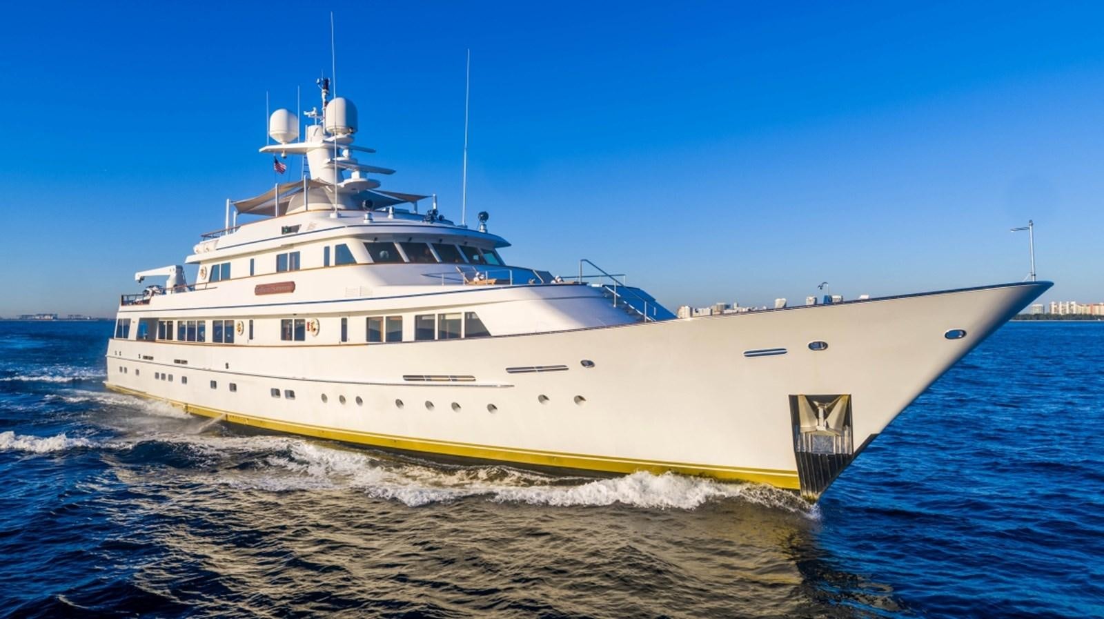 a large white boat on the water aboard DRAMA QUEEN Yacht for Sale