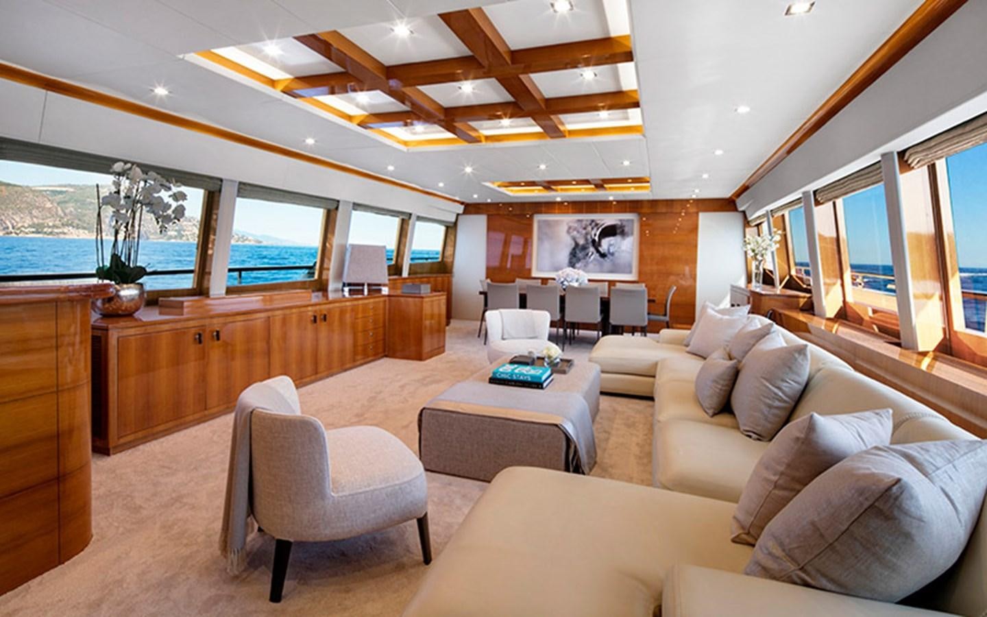 a living room with a large window aboard NYOTA Yacht for Charter