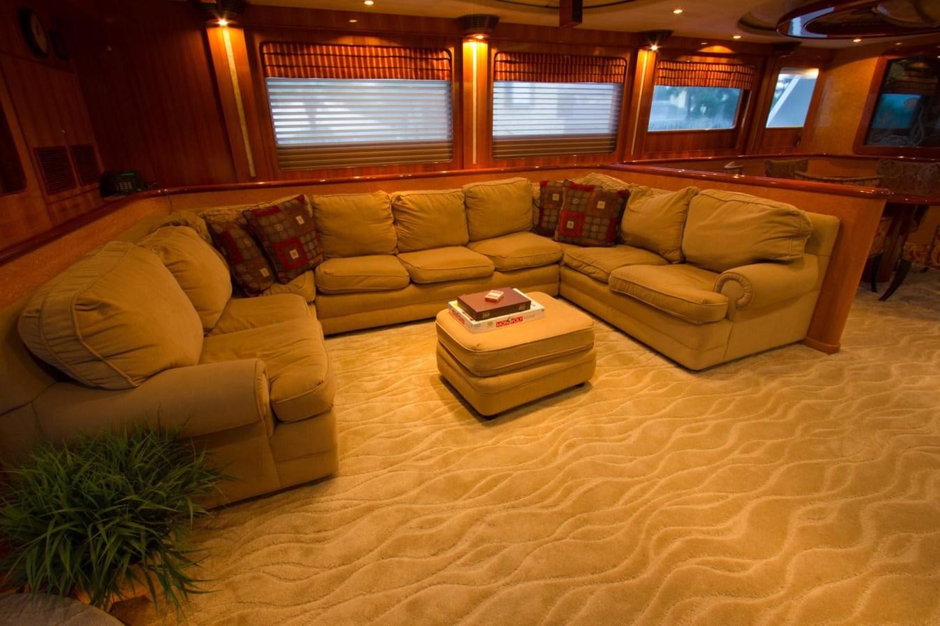 a living room with a couch and a table aboard GLEN ELLEN Yacht for Sale