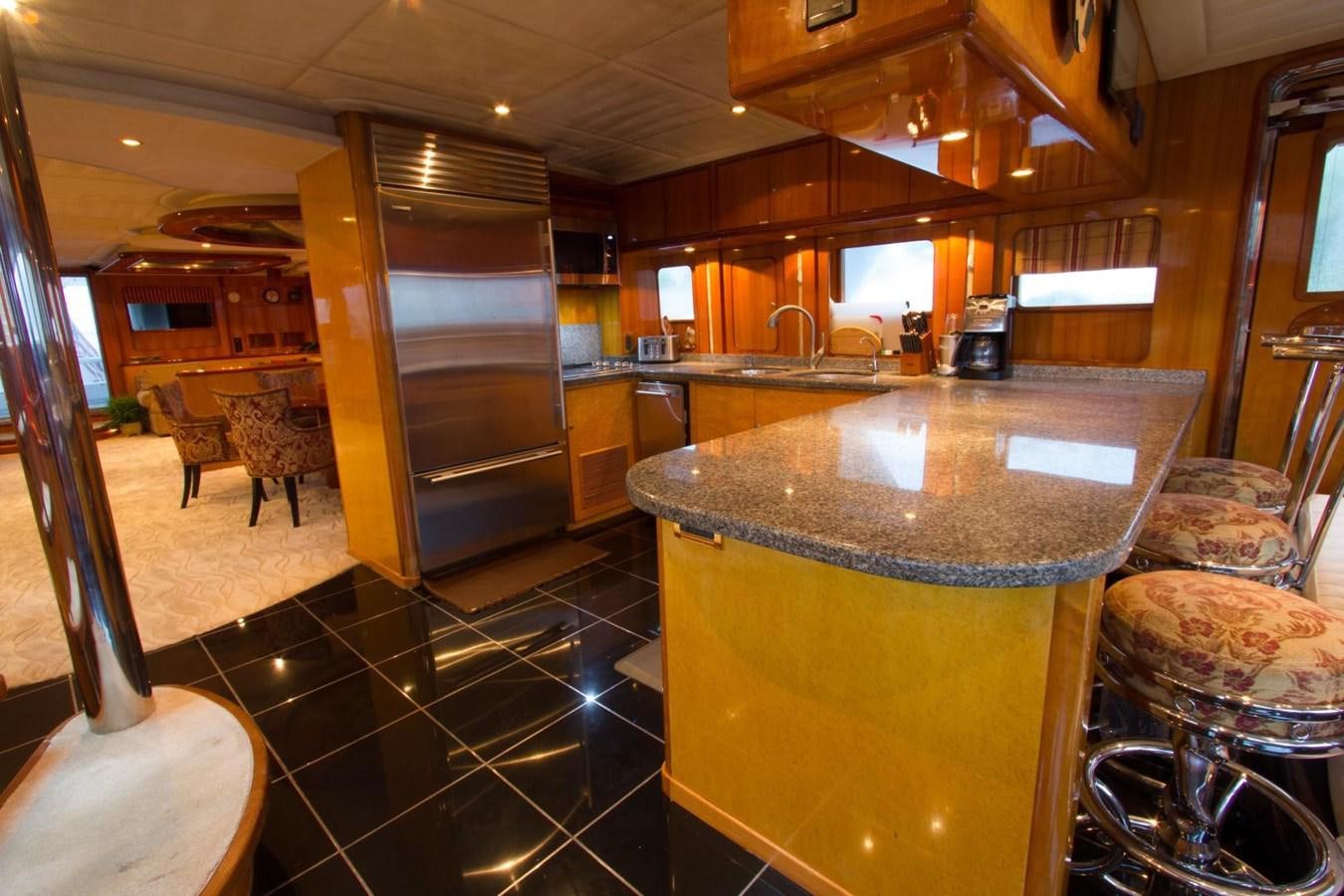 a kitchen with a large island aboard GLEN ELLEN Yacht for Sale