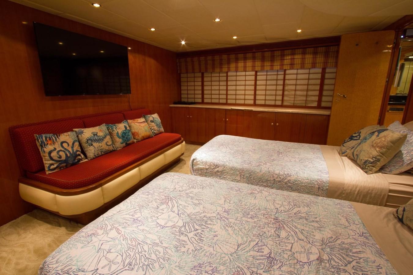 a bed and a couch in a room aboard GLEN ELLEN Yacht for Sale