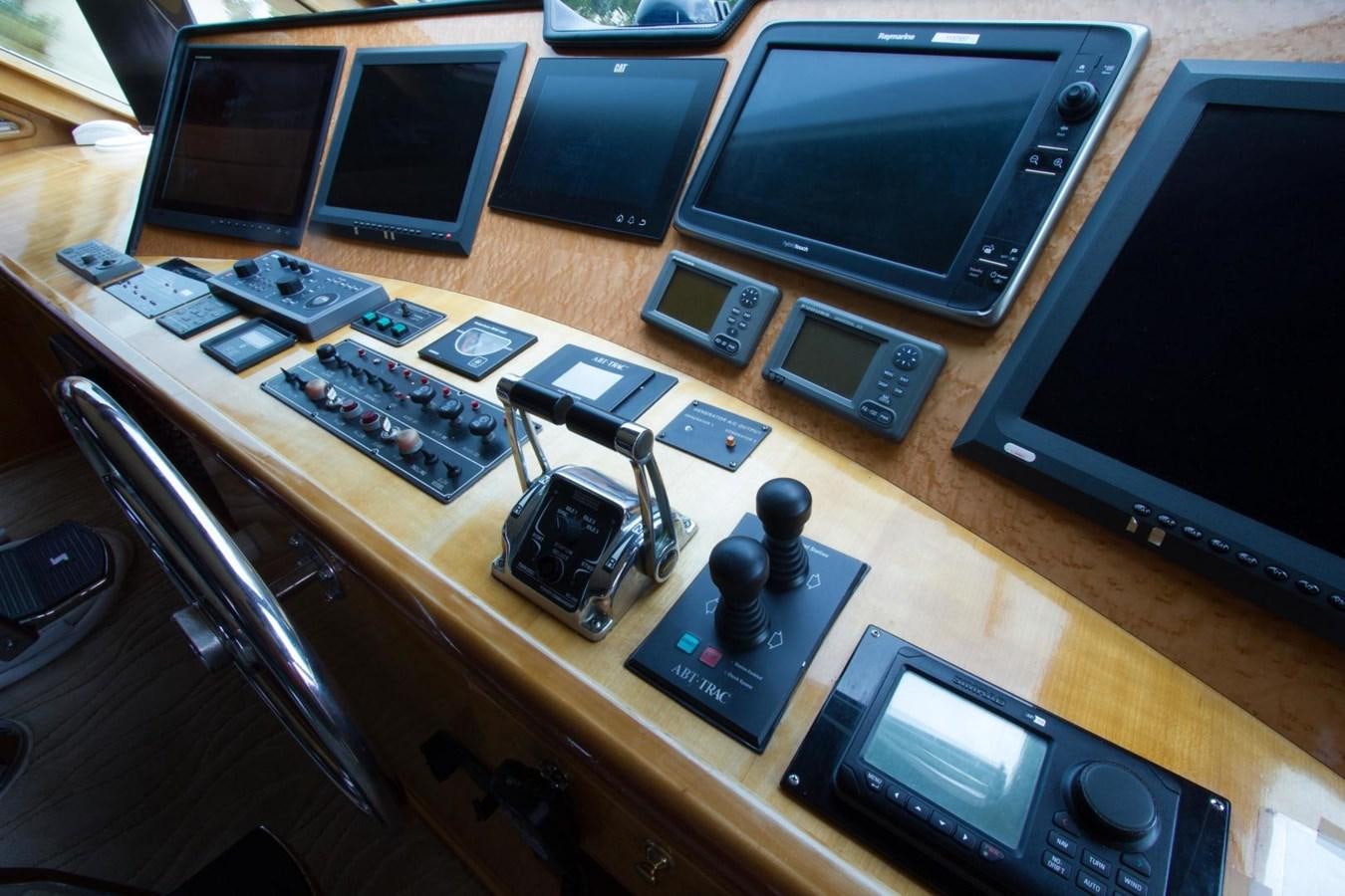 a table with a computer and other electronic devices on it aboard GLEN ELLEN Yacht for Sale