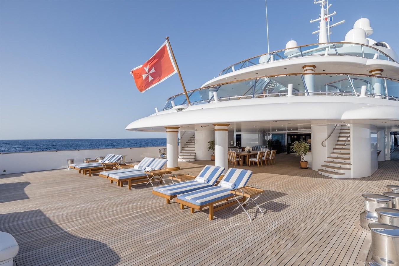 a large white boat on a beach aboard CARINTHIA VII Yacht for Sale