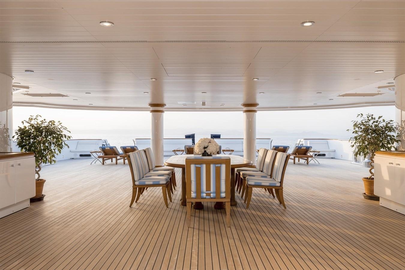 a room with a table and chairs aboard CARINTHIA VII Yacht for Sale