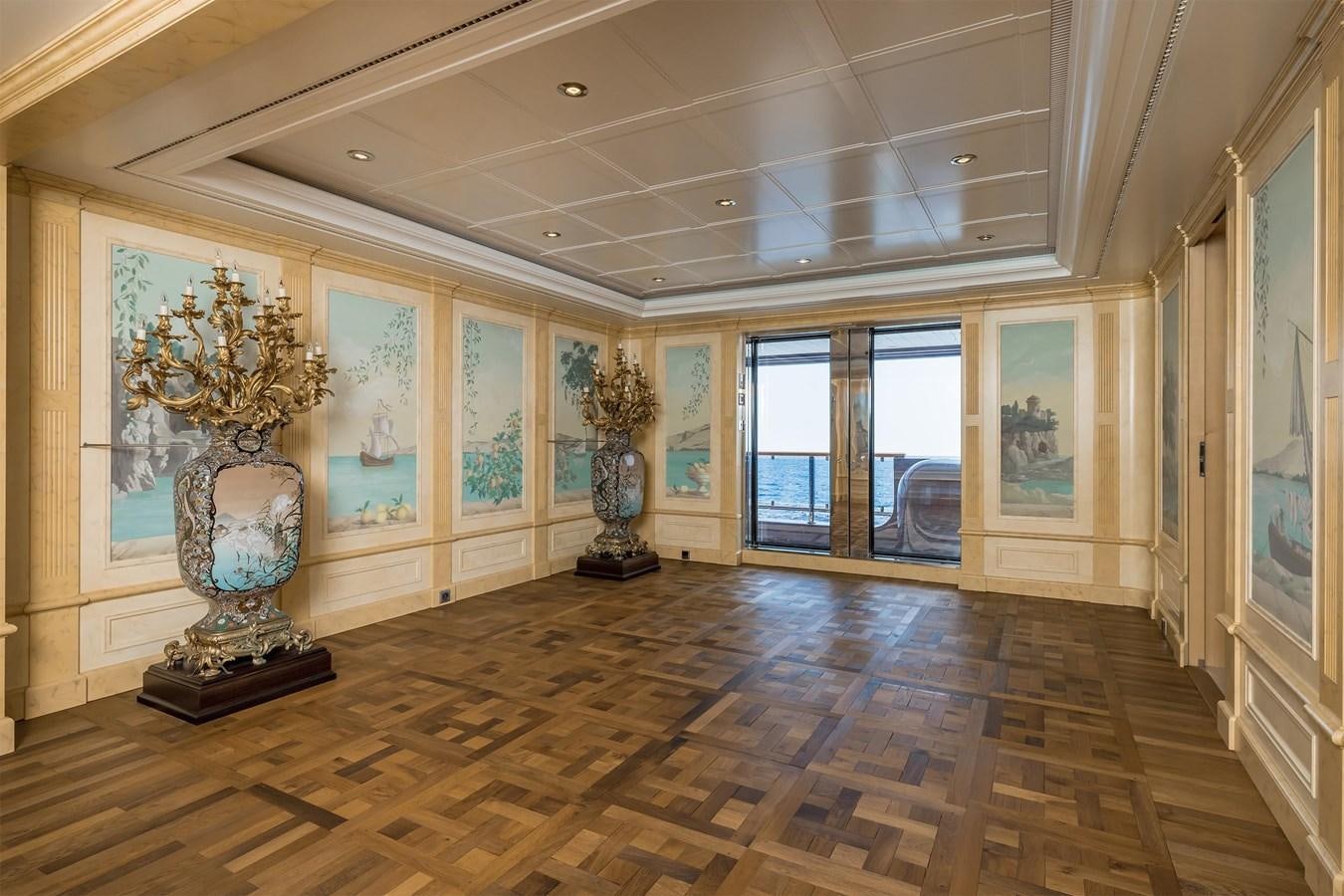 a large room with a large painting aboard CARINTHIA VII Yacht for Sale