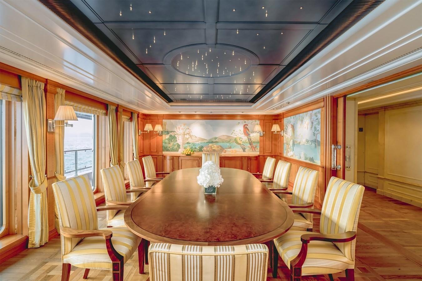 a dining room with a table and chairs aboard CARINTHIA VII Yacht for Sale