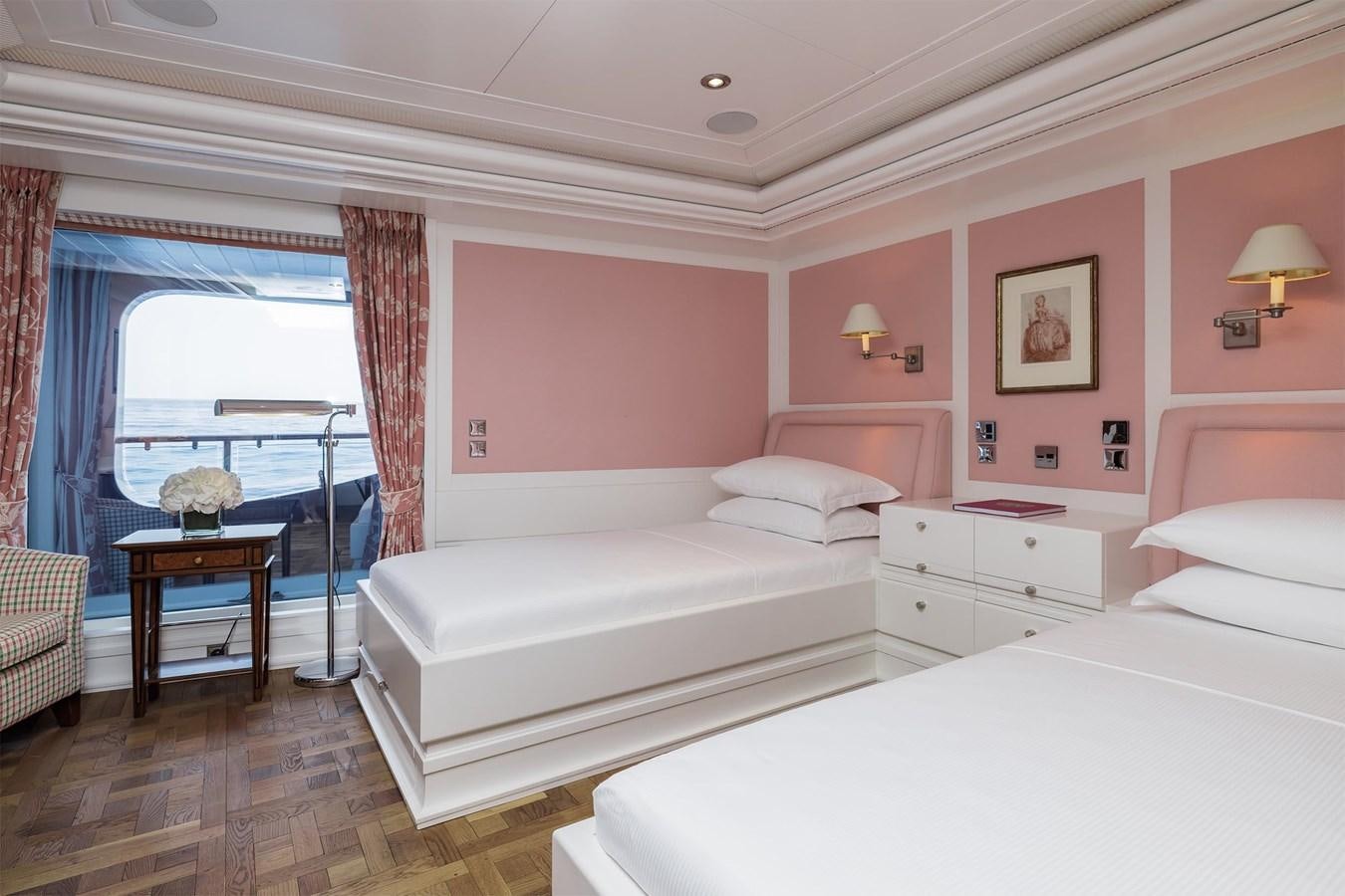 a room with two beds aboard CARINTHIA VII Yacht for Sale