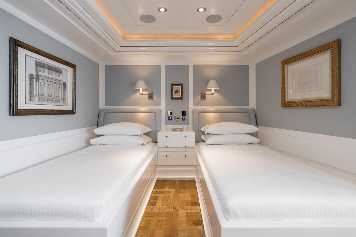 a room with a couple of beds aboard CARINTHIA VII Yacht for Sale