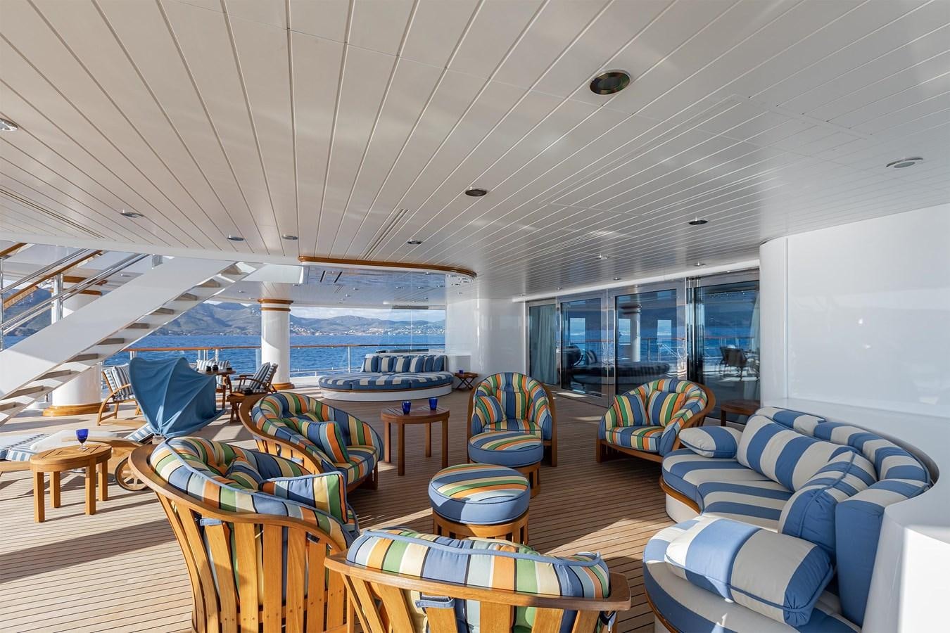 a large living room with a large swimming pool aboard CARINTHIA VII Yacht for Sale