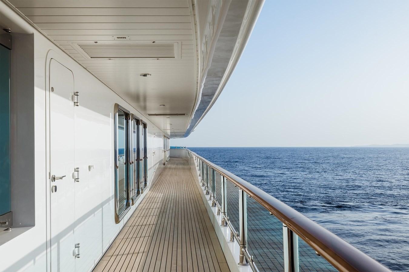a long boardwalk leading to the ocean aboard CARINTHIA VII Yacht for Sale