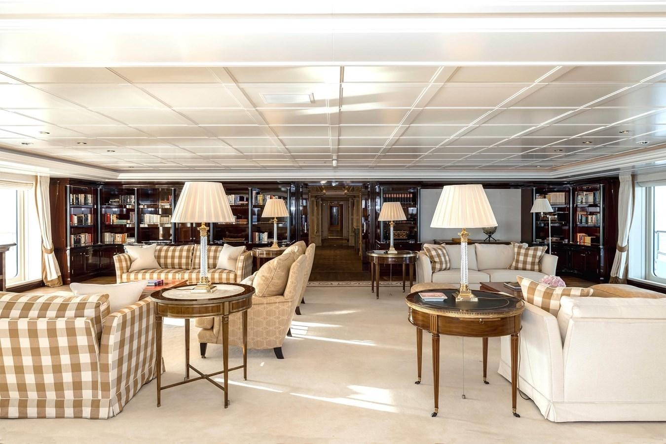 a living room with a couch and a table aboard CARINTHIA VII Yacht for Sale