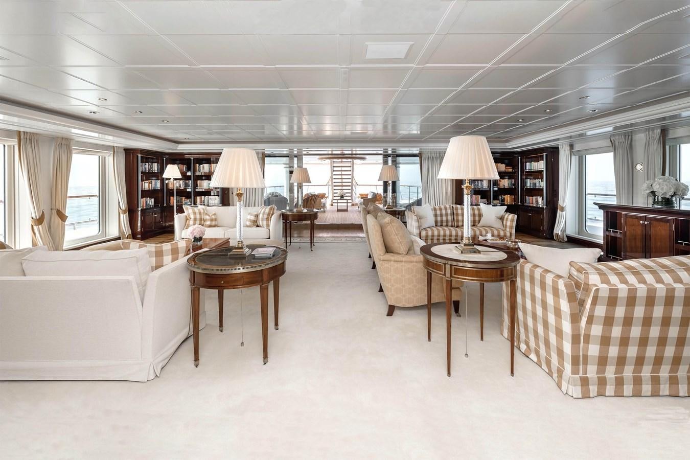 a living room with a couch and a table aboard CARINTHIA VII Yacht for Sale