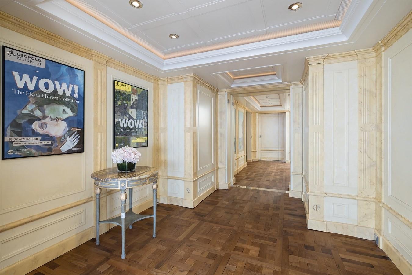 a room with a table and a chair aboard CARINTHIA VII Yacht for Sale