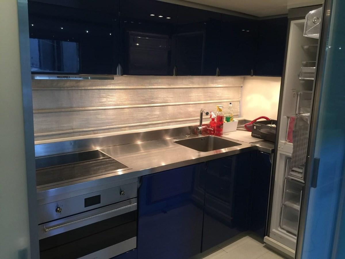 a kitchen with a sink and cabinets aboard MATHISSE Yacht for Sale