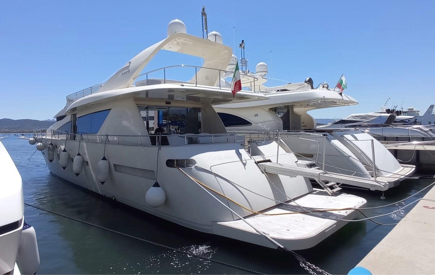 a white boat with a blue roof aboard MATHISSE Yacht for Sale