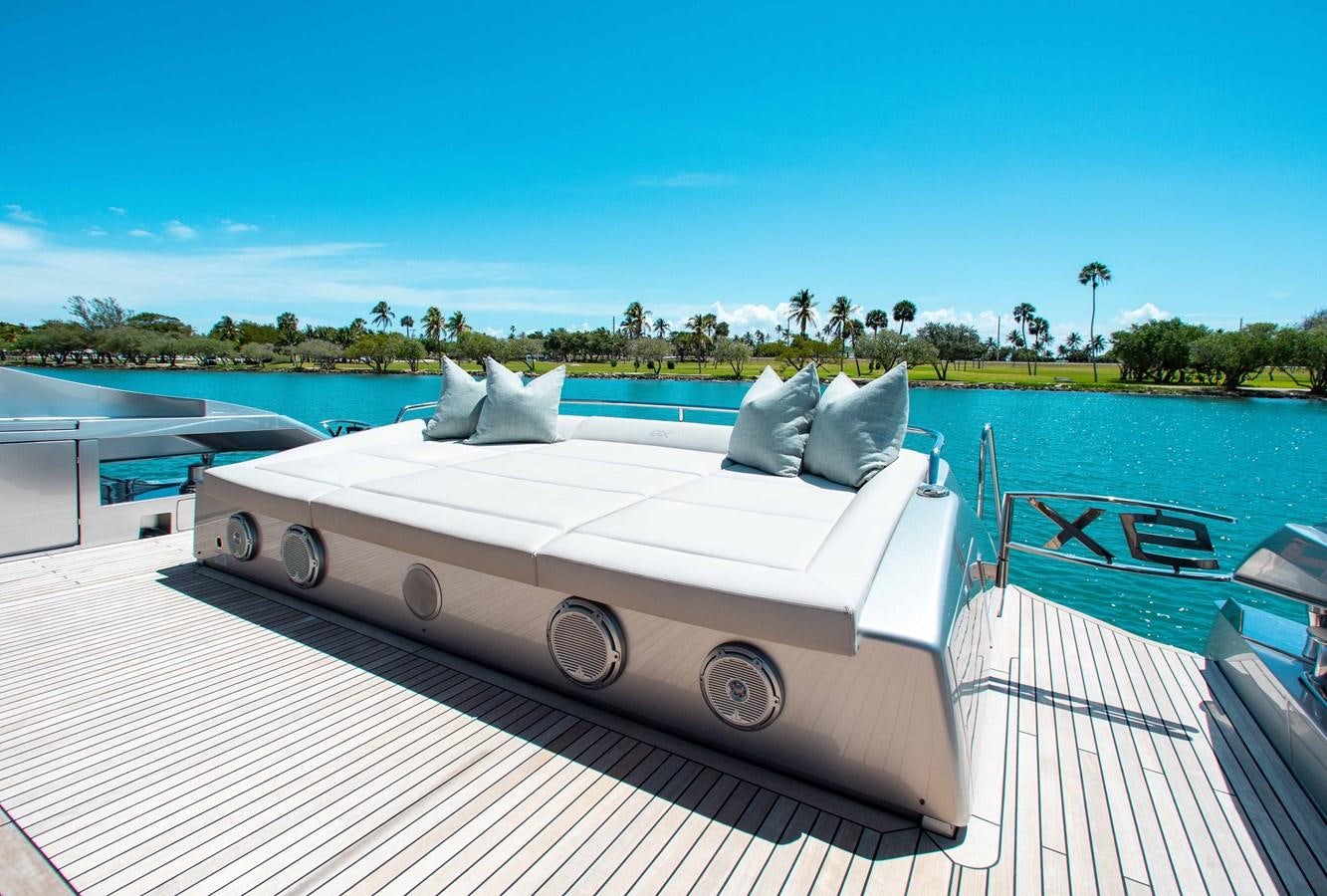 a white bed on a deck aboard LADY K Yacht for Sale