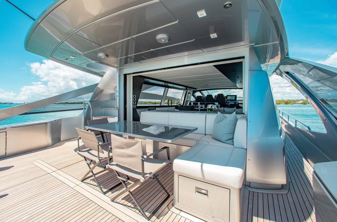 a boat with a table and chairs aboard LADY K Yacht for Sale