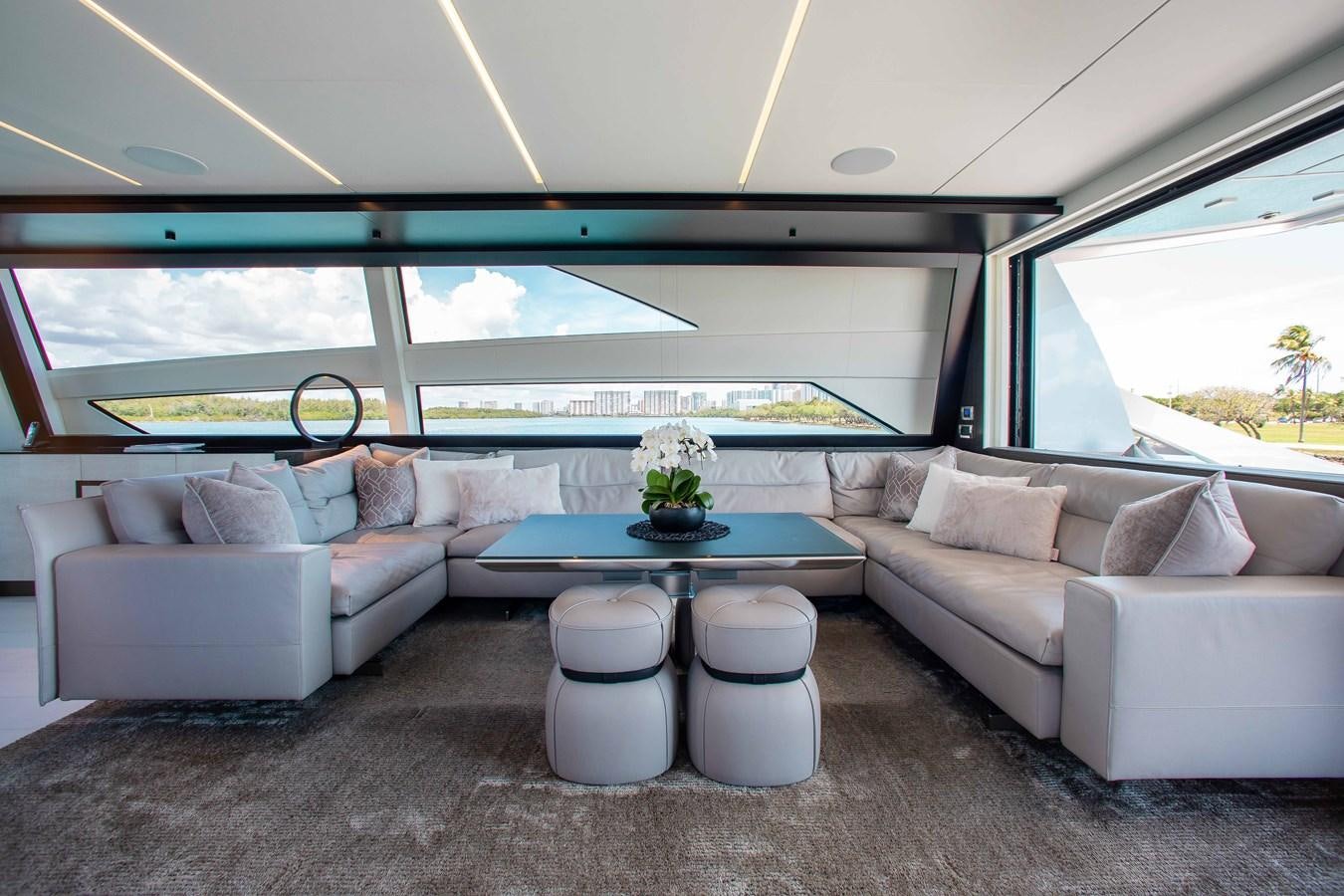 a living room with a couch and a table aboard LADY K Yacht for Sale