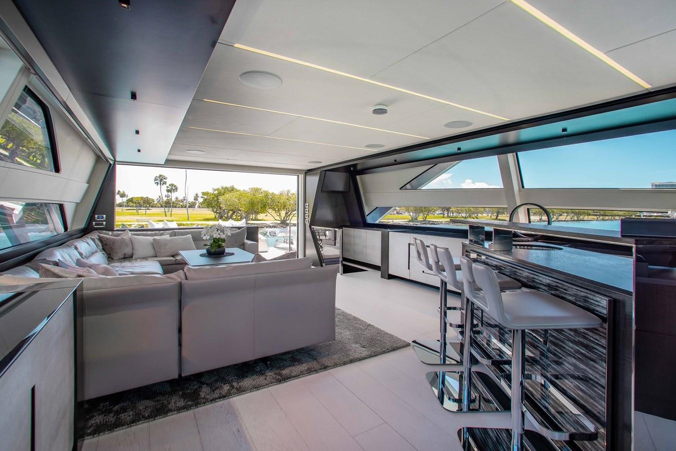 a living room with a couch and a table aboard LADY K Yacht for Sale