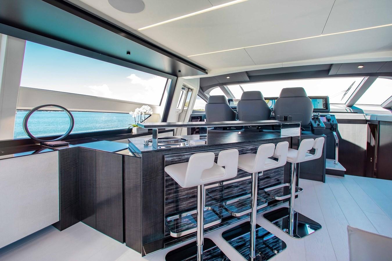 a room with a table and chairs aboard LADY K Yacht for Sale