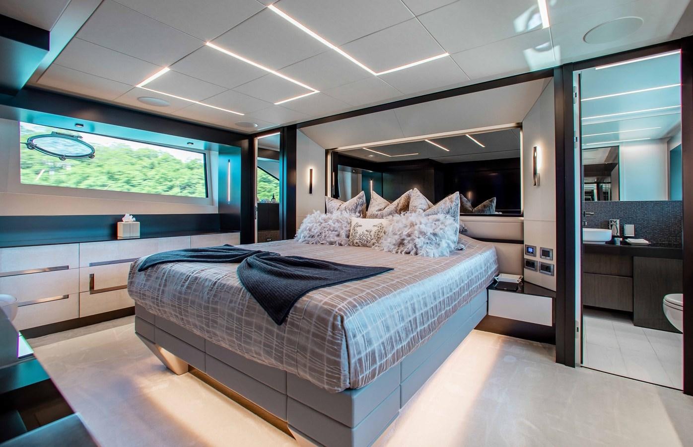 a bedroom with a large bed aboard LADY K Yacht for Sale