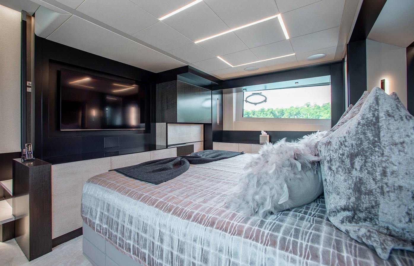 a bedroom with a large bed aboard LADY K Yacht for Sale