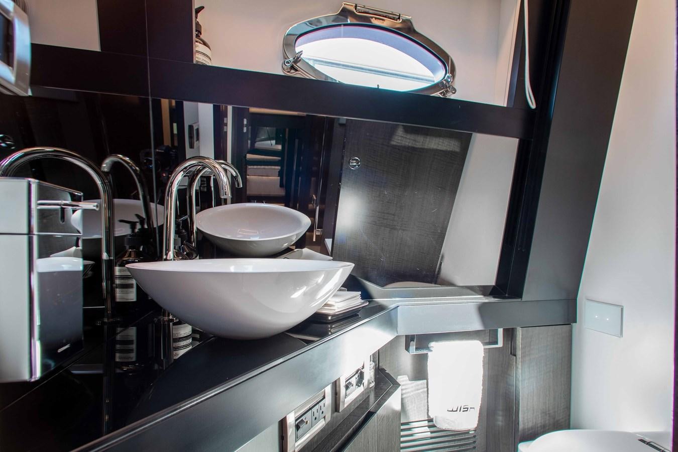 a bathroom with sinks and mirrors aboard LADY K Yacht for Sale