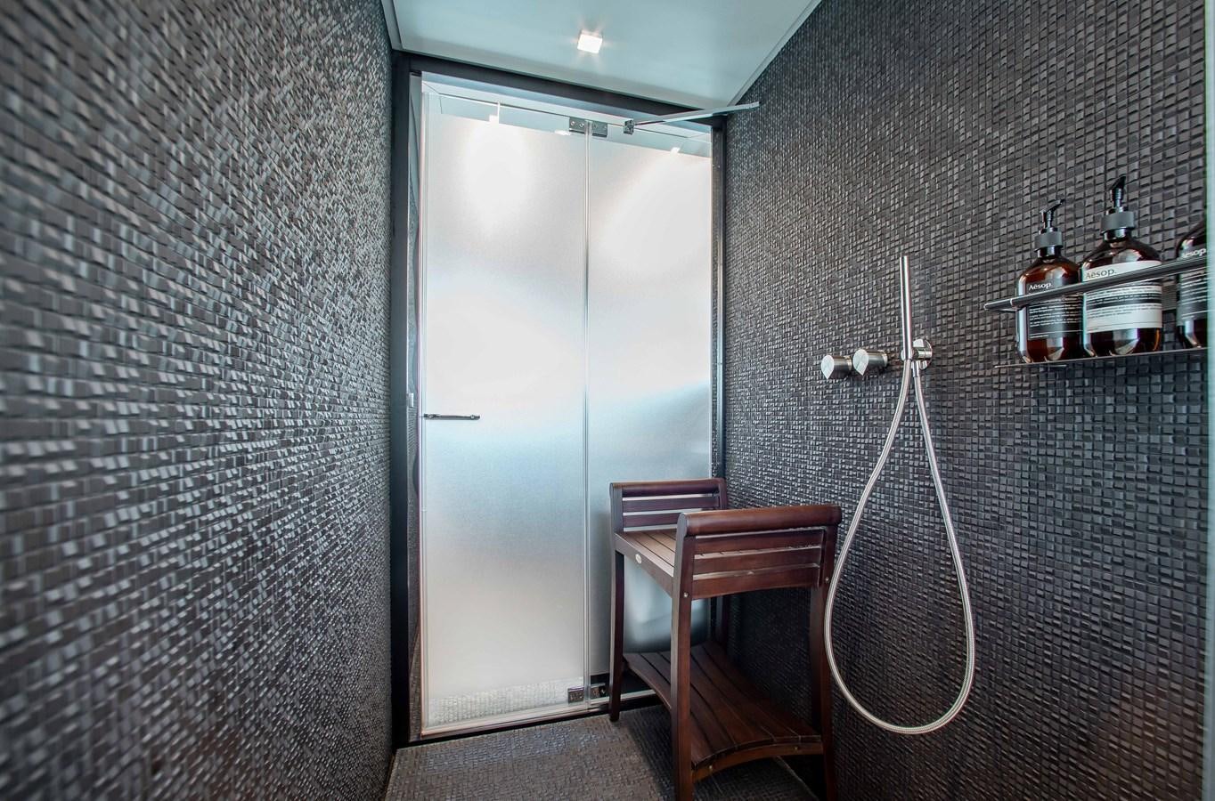 a room with a chair and a desk aboard LADY K Yacht for Sale