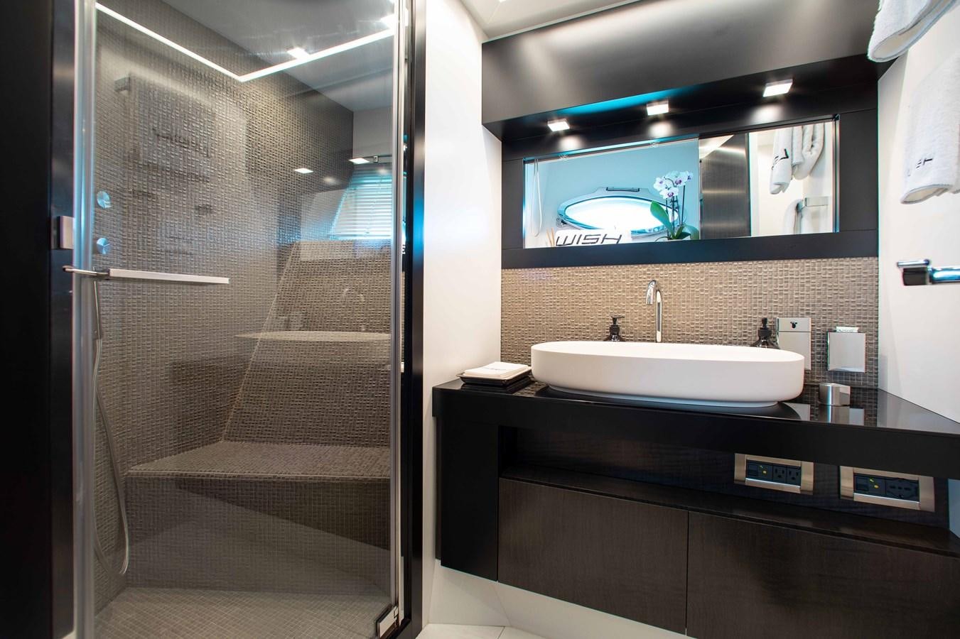 a bathroom with a large mirror aboard LADY K Yacht for Sale