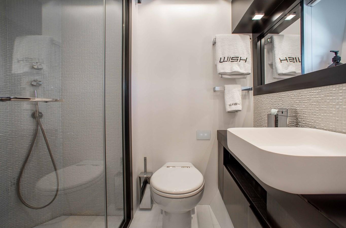 a bathroom with a sink toilet and shower aboard LADY K Yacht for Sale