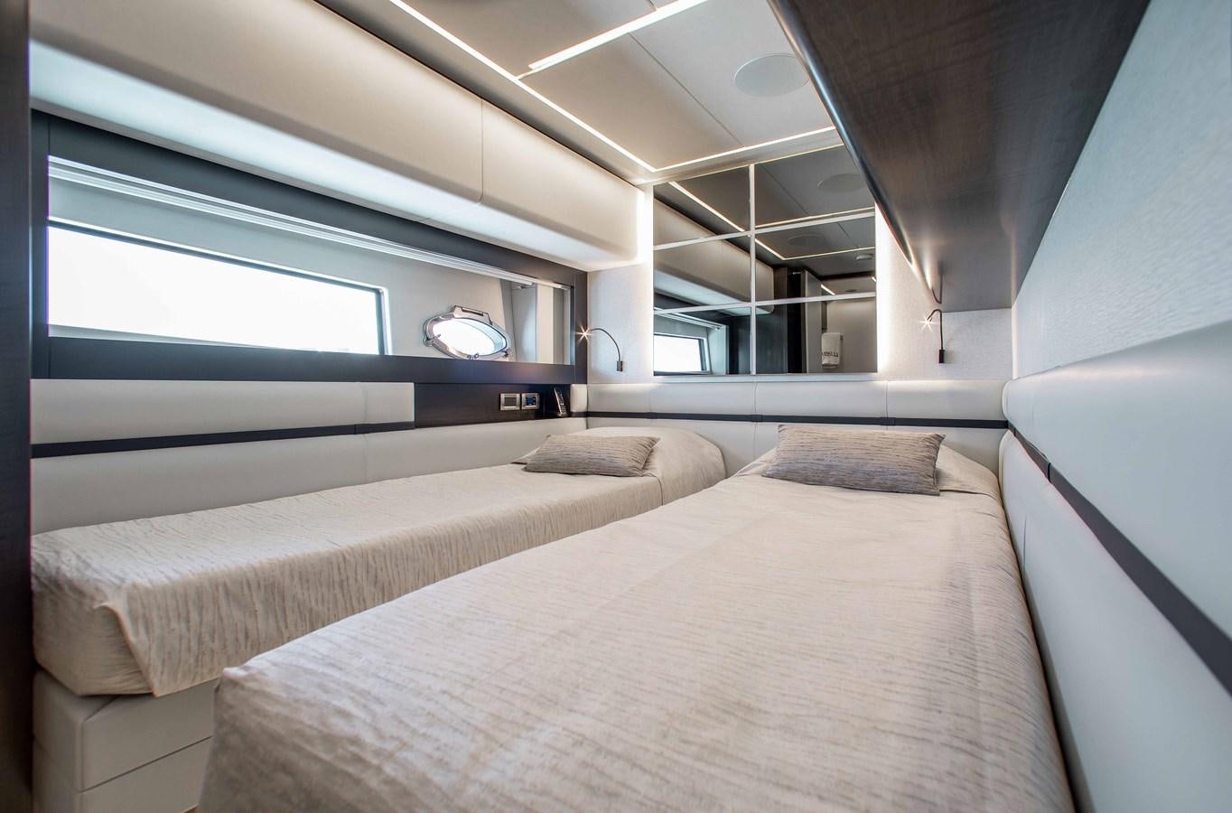 a room with two beds aboard LADY K Yacht for Sale