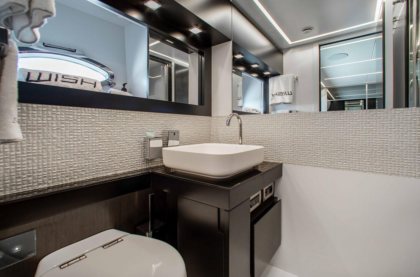 a bathroom with a sink and a mirror aboard LADY K Yacht for Sale