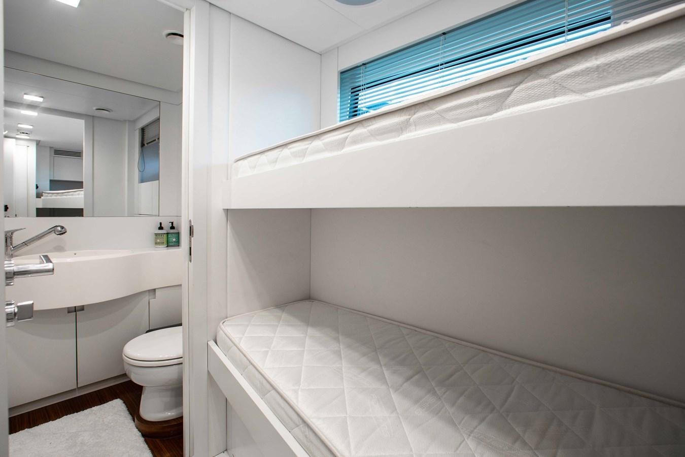 a bathroom with a tub toilet and sink aboard LADY K Yacht for Sale