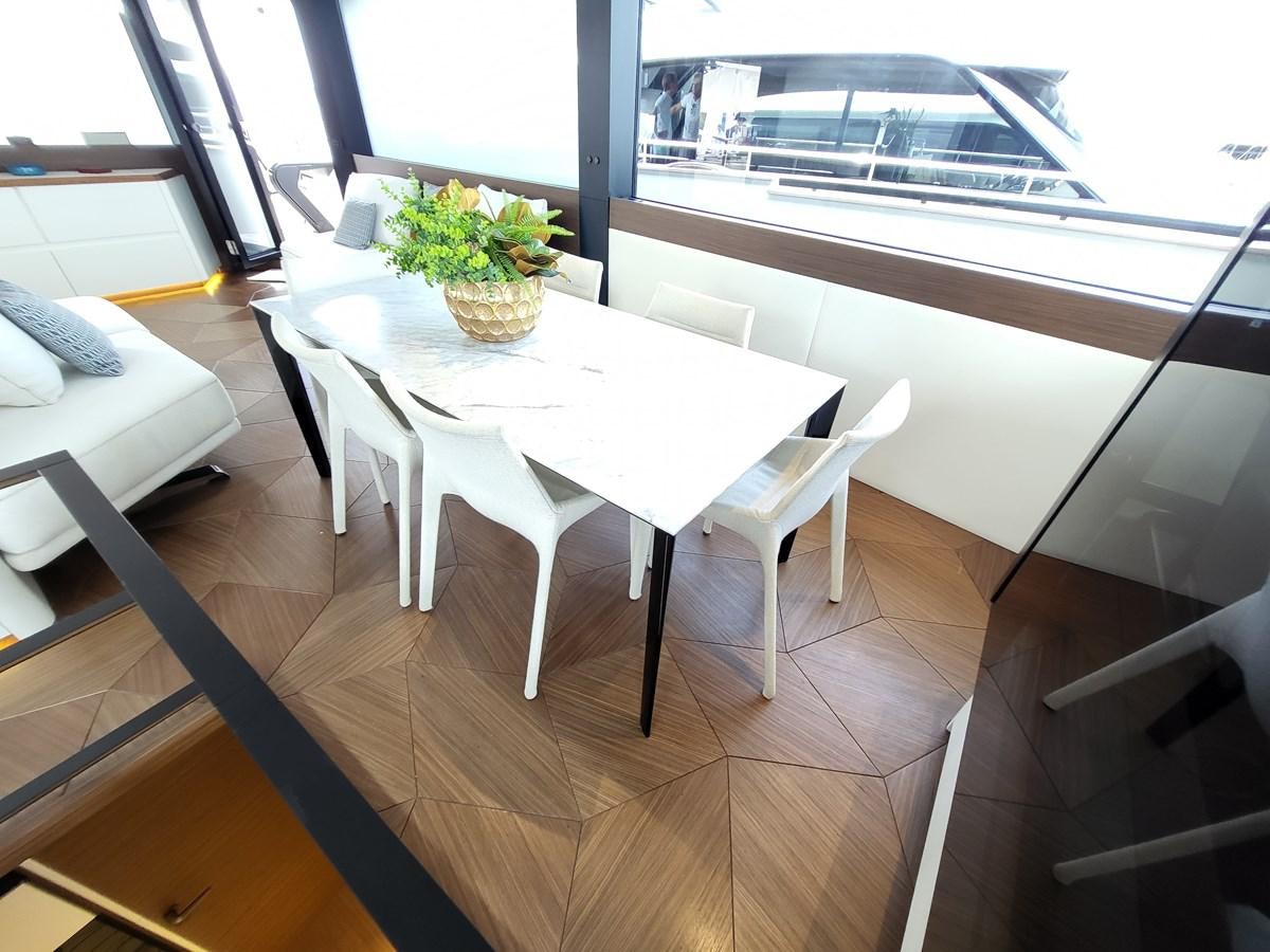 a table with a plant on it aboard EVO V8  Yacht for Sale