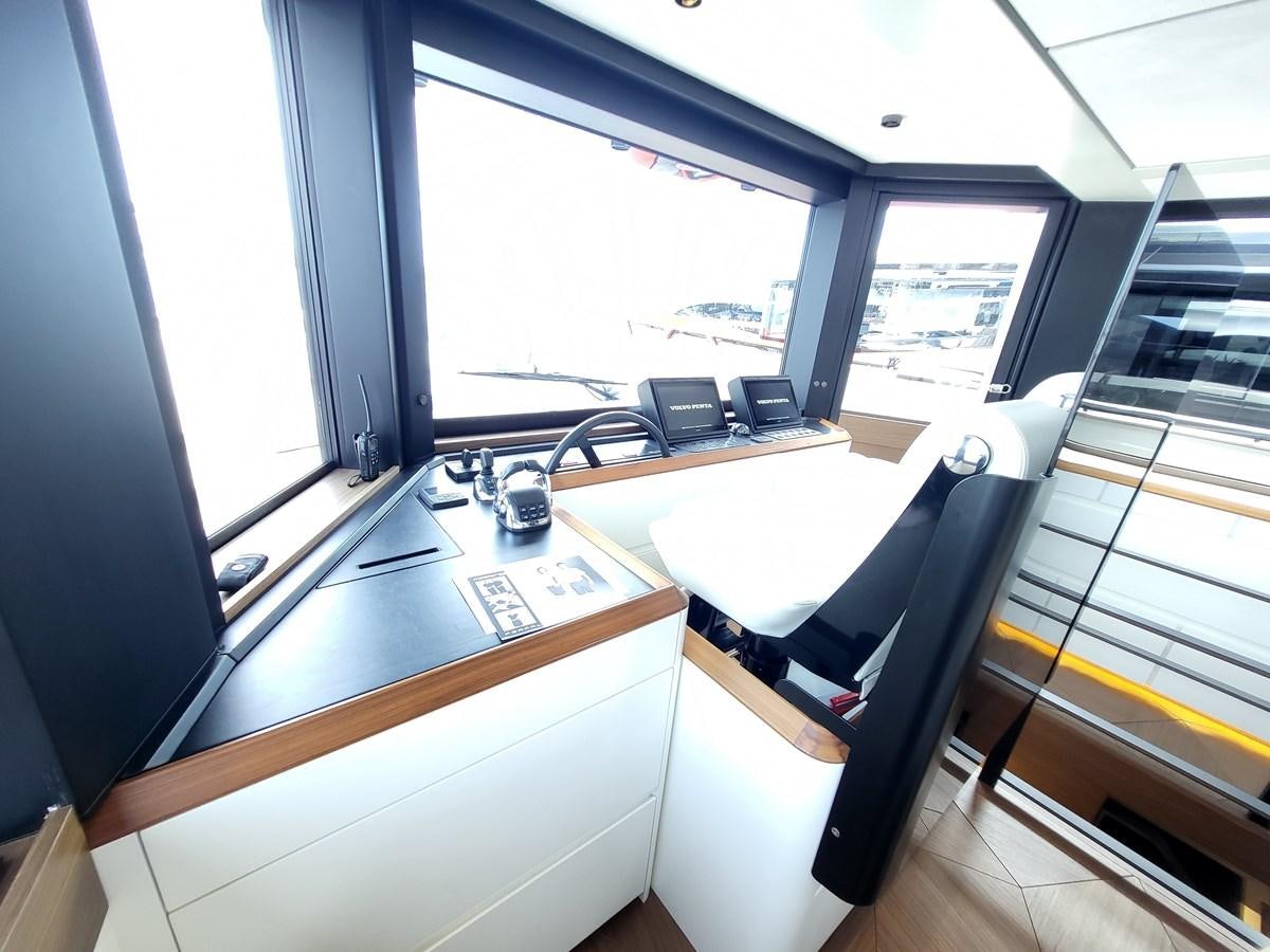 a kitchen with a window aboard EVO V8  Yacht for Sale