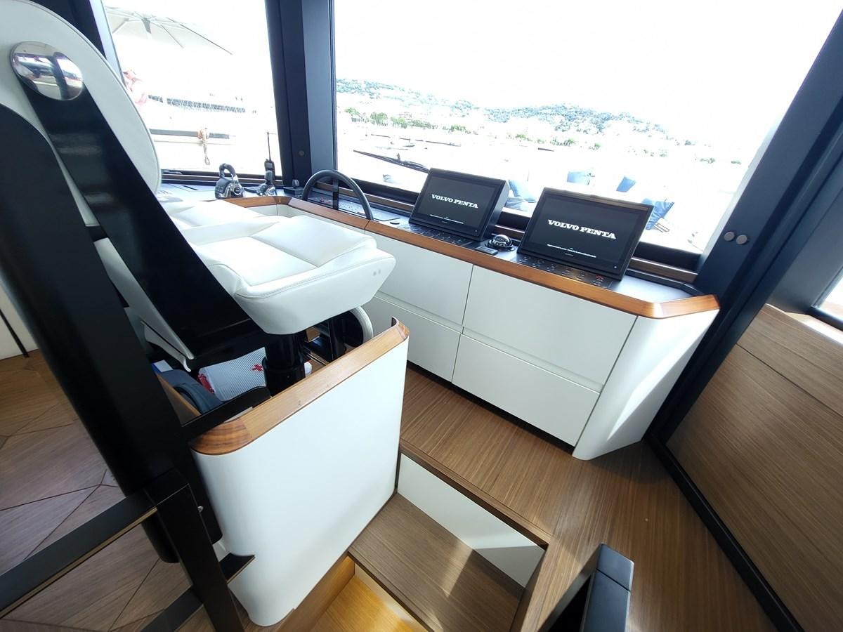 a room with a desk and a window aboard EVO V8  Yacht for Sale