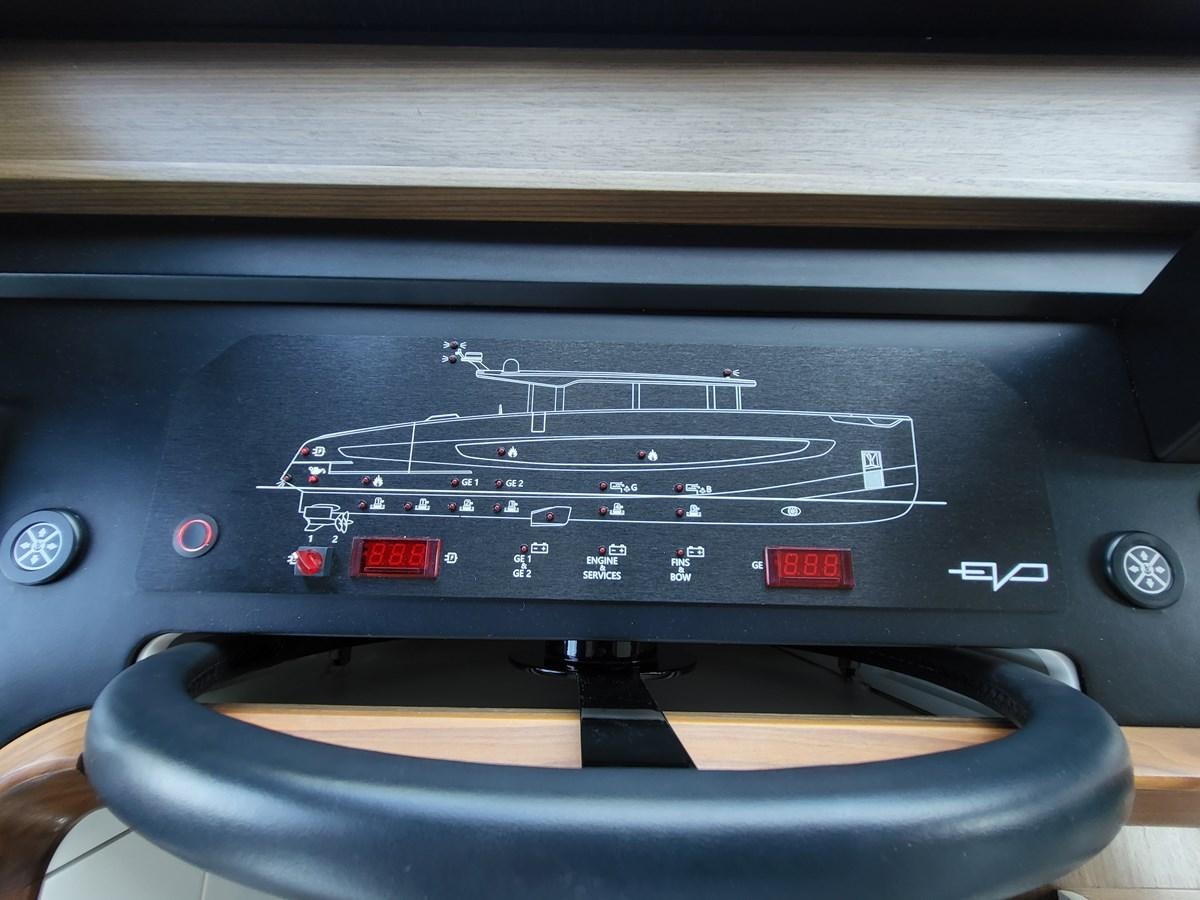 a black electronic device aboard EVO V8  Yacht for Sale