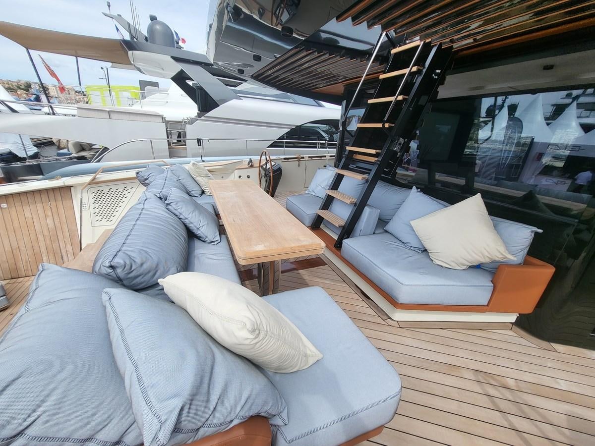 a room with a couch and a table aboard EVO V8  Yacht for Sale