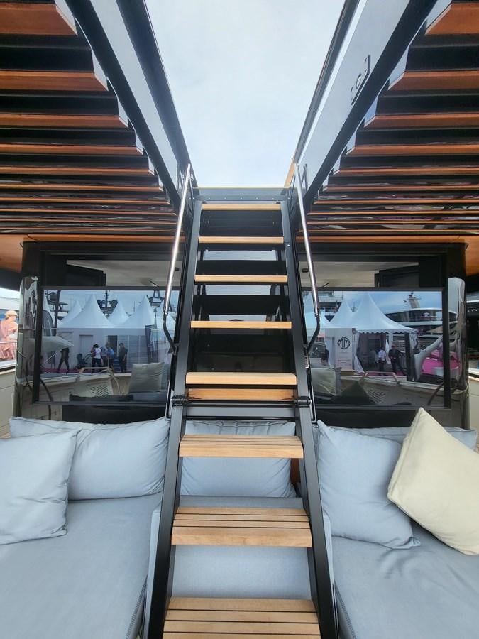 a boat with a wood deck aboard EVO V8  Yacht for Sale
