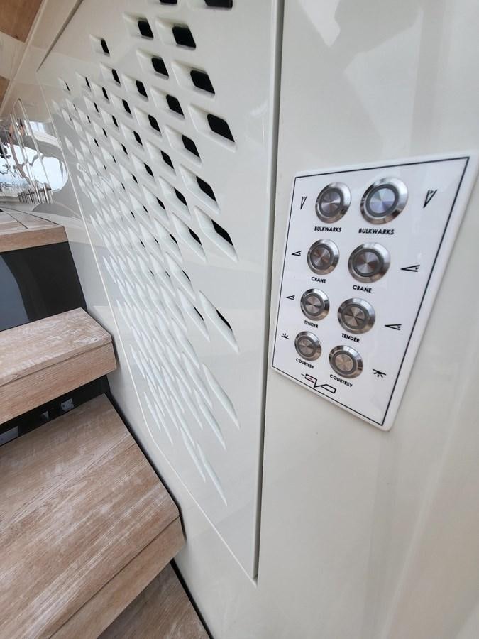 a white machine with black and white squares aboard EVO V8  Yacht for Sale