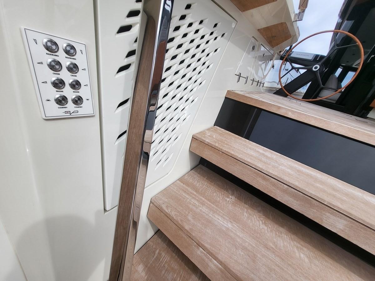 a white refrigerator with a microwave aboard EVO V8  Yacht for Sale