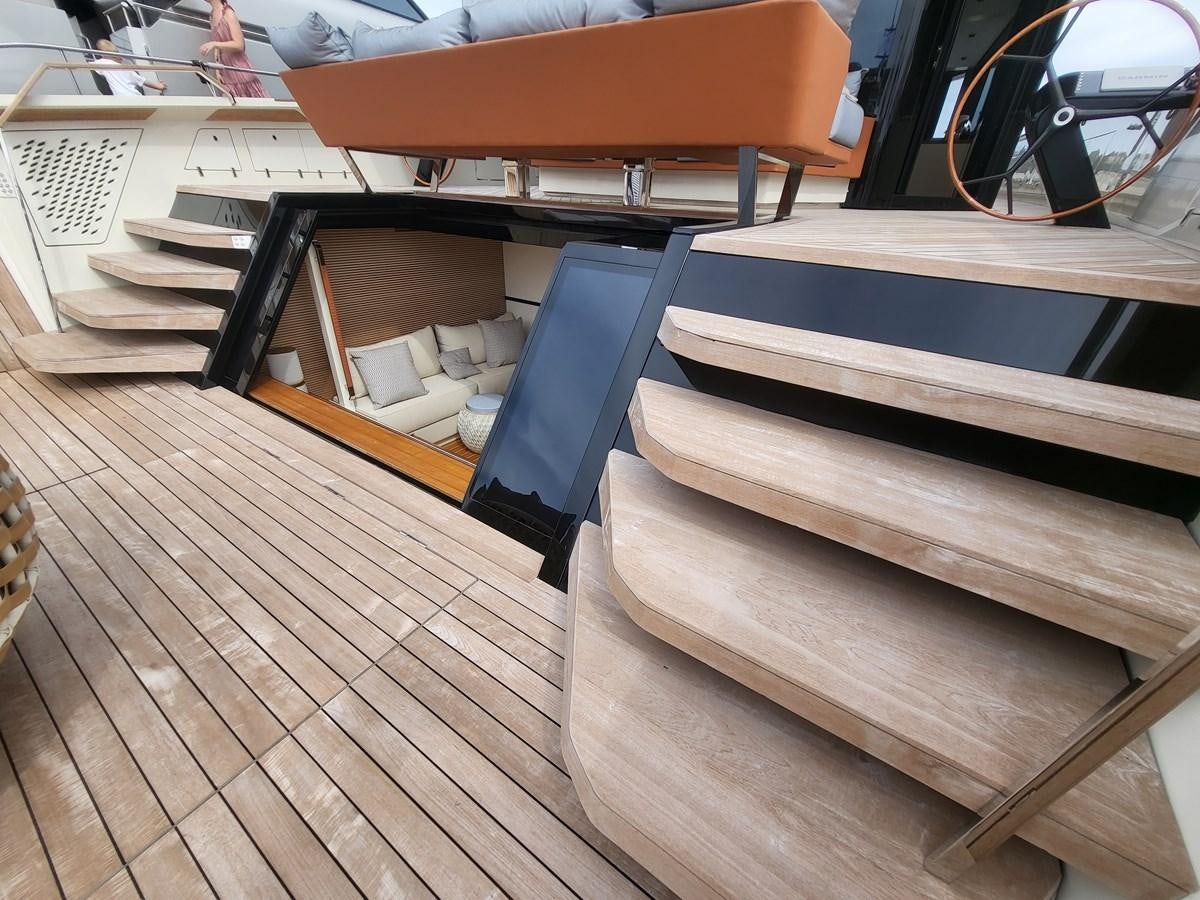 a row of wooden benches aboard EVO V8  Yacht for Sale