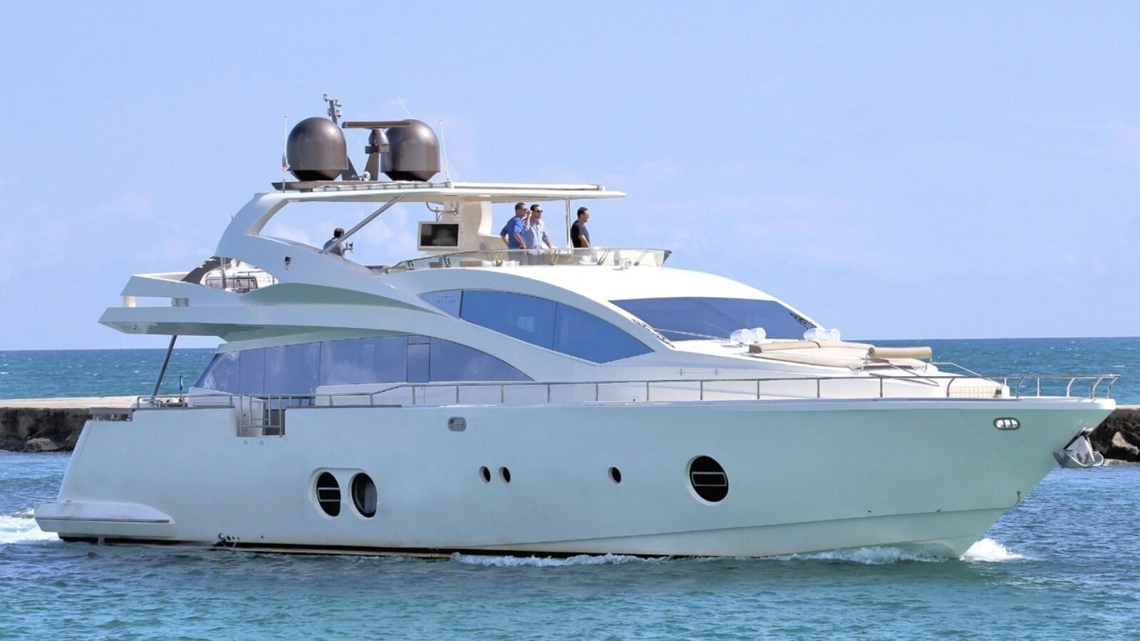 a white yacht with people on it aboard KAERU Yacht for Sale