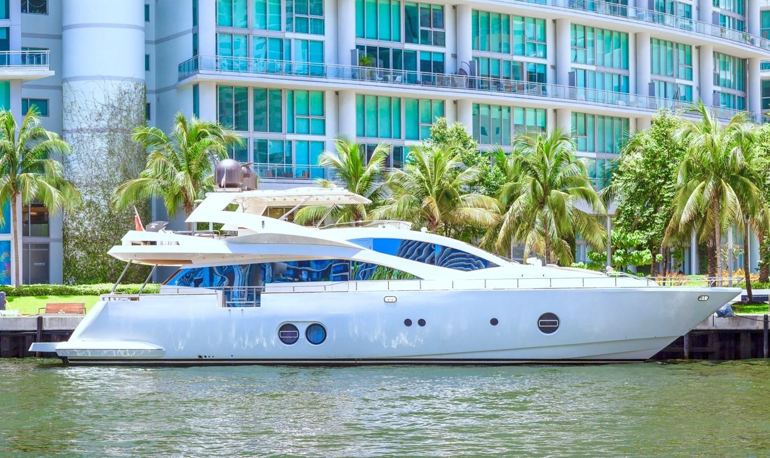 a white boat in a body of water aboard KAERU Yacht for Sale