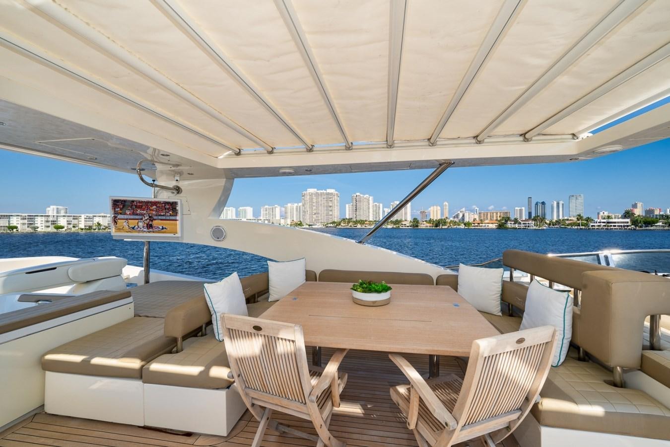 a room with a table and chairs aboard KAERU Yacht for Sale